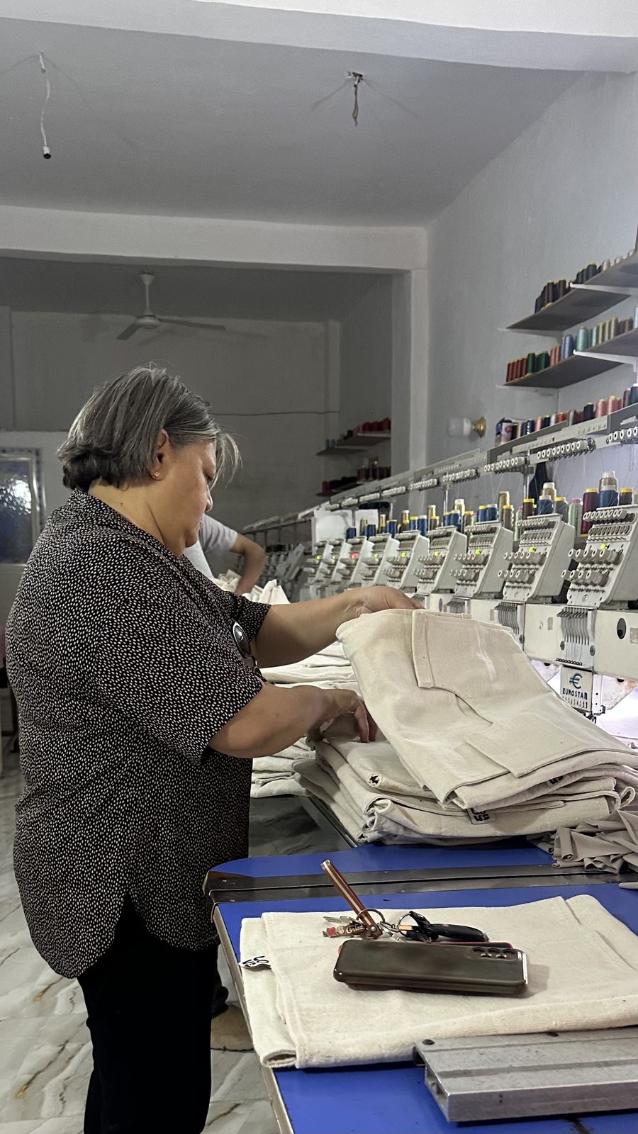 Teta Lolou folding finished pieces in the workshop